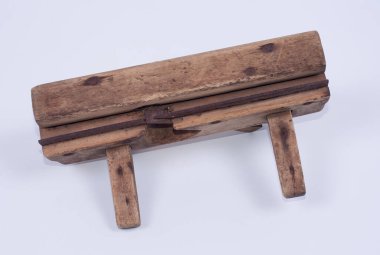 an old vintage hand figure planer on white background.