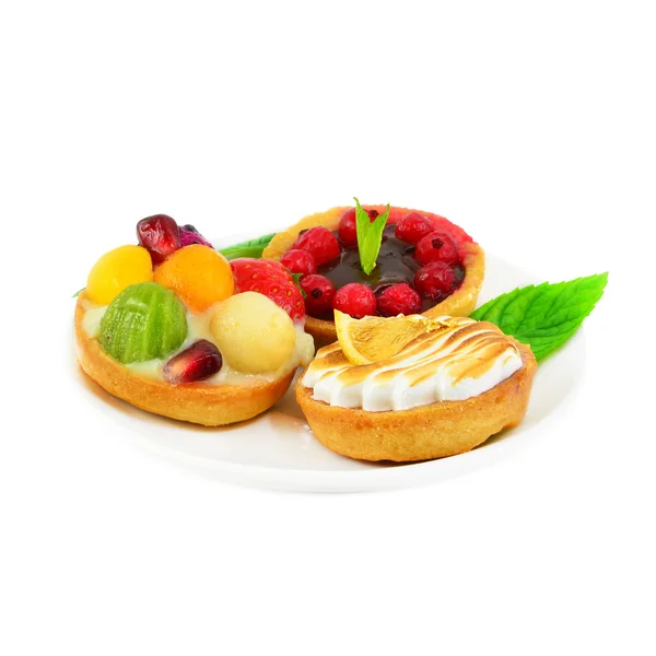 Small cakes with fruit and cream — Stock Photo, Image