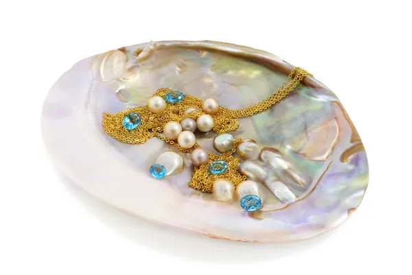 Blue topaz with pearls and gold — Stock Photo, Image