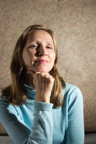 A woman in a blue sweater — Stock Photo, Image