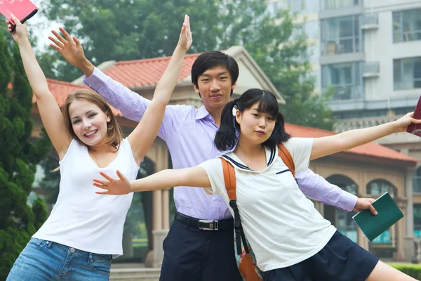 Group of American and Asian students outside of college campus — Stock Photo, Image