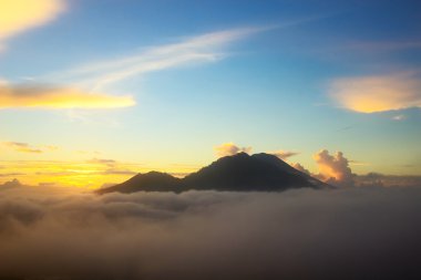 Summer landscape in mountain valley and sunrise on cloudy sky