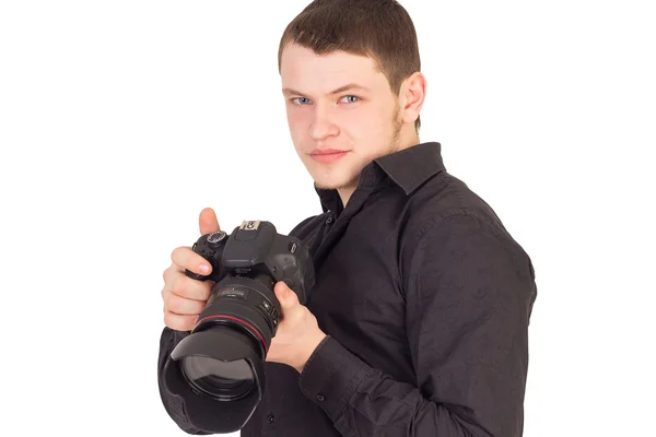 Retrato de fotógrafo profesional sosteniendo la cámara y sonriendo — Foto de Stock