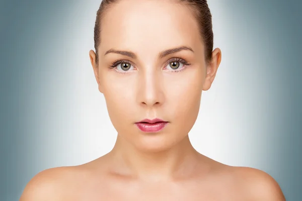 Face of beautiful young woman with perfect clean skin Stock Photo