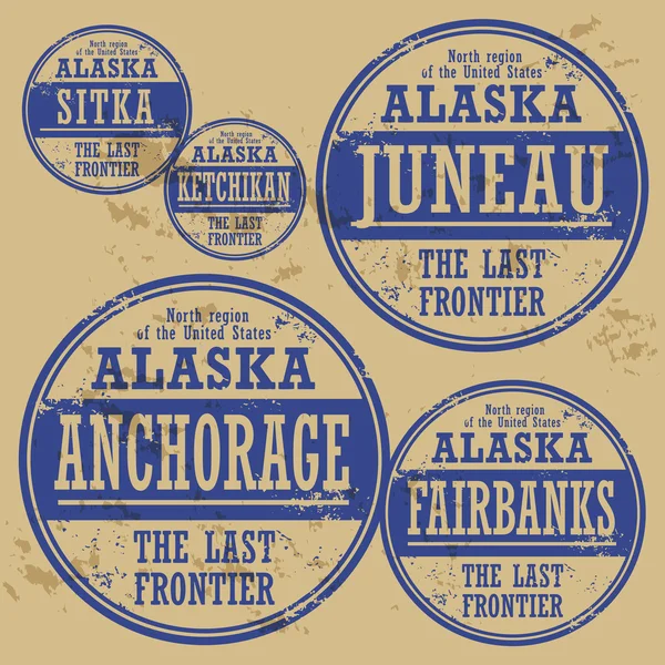 Grunge rubber stamp set with names of Alaska cities — Stock Vector