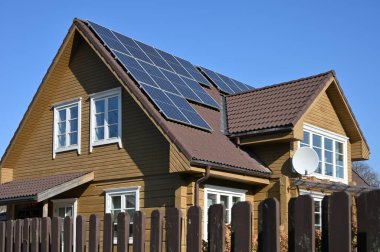 Vilnius - October 10: Solar panels on the roof of a house at October 10, 2021 in Vilnius, Lithuania clipart