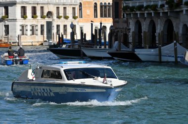 Venice, Italy - November 04, 2021: Police boat on a Grand Canal in Venice, Italy