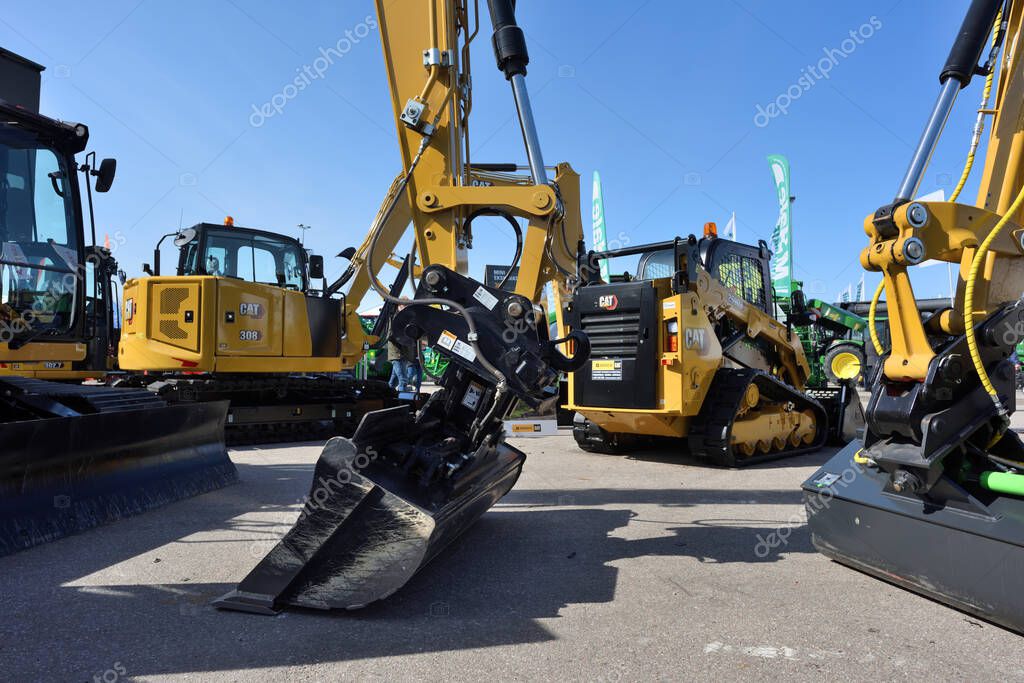 Kaunas, Lithuania - March 31, 2022: Caterpillar heavy duty excavators at International Agricultural Exhibition in Kaunas, Lithuania
