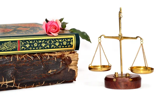 Rose on a book and scales of justice over white background — Stock Photo, Image