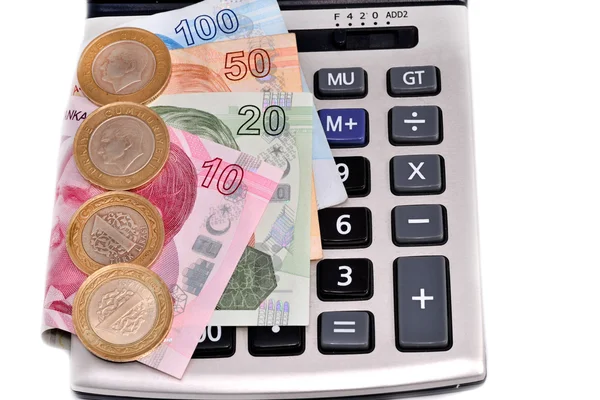 Dinheiro turco e máquina de calcular no fundo branco — Fotografia de Stock