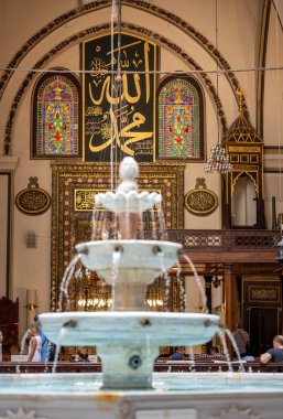BURSA, TURKEY - AUGUST 21: An interior view of Grand Mosque (Ulu Cami) on August 21, 2022 in Bursa, Turkey. The very aesthetic fountain of the Great Mosque of Bursa, which receives light from its dome.