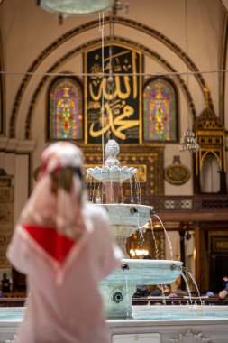 BURSA, TURKEY - AUGUST 21: An interior view of Grand Mosque (Ulu Cami) on August 21, 2022 in Bursa, Turkey. The very aesthetic fountain of the Great Mosque of Bursa, which receives light from its dome.