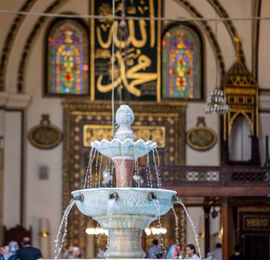 BURSA, TURKEY - AUGUST 21: An interior view of Grand Mosque (Ulu Cami) on August 21, 2022 in Bursa, Turkey. The very aesthetic fountain of the Great Mosque of Bursa, which receives light from its dome.
