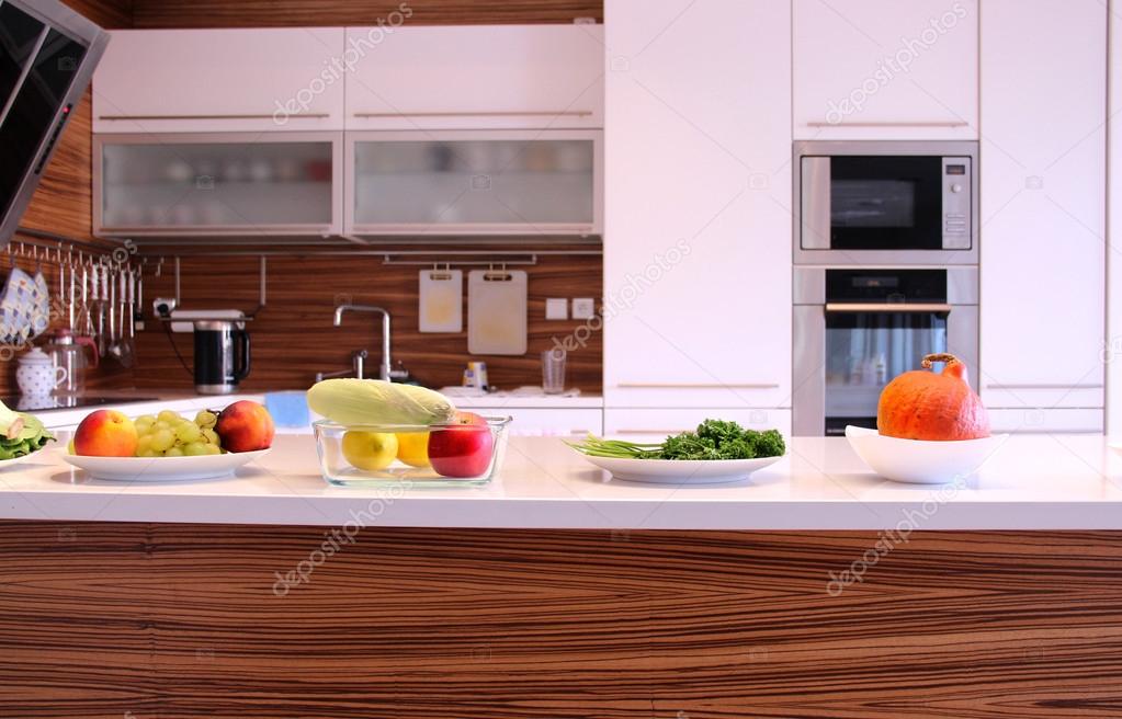Fruit and vegetables in the well designed modern kitchen