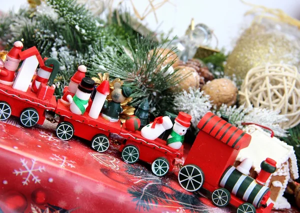 Christmas decorations and toy red train — Stock Photo, Image