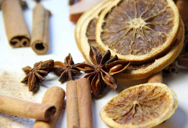 Mix of cinnamon sticks and dry orange — Stock Photo, Image