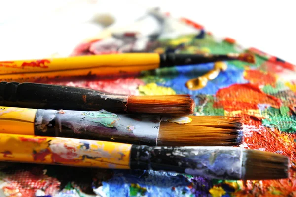 Paints and paintbrushes — Stock Photo, Image