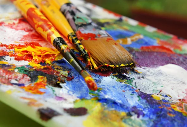 Art palette and paintbrushes