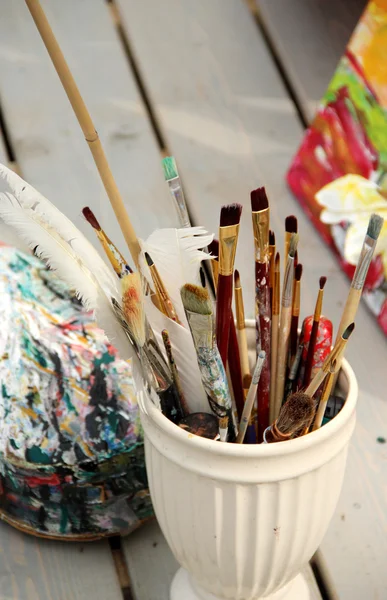 Vivid paintbrushes at the atelier
