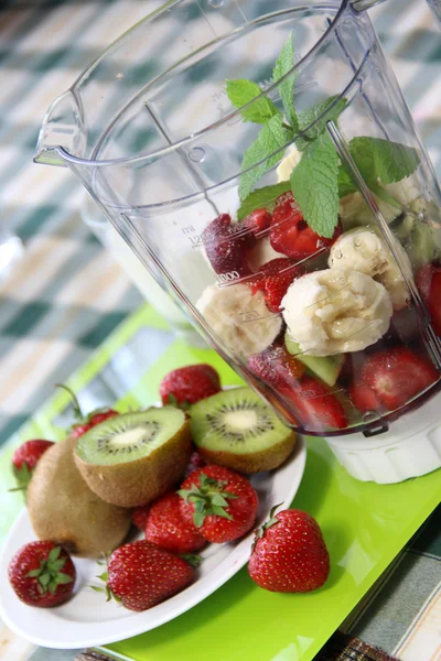 Fresh fruits in the blender — Stock Photo, Image