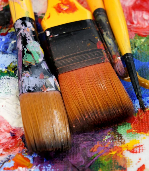Art palette and mix of paintbrushes — Stock Photo, Image