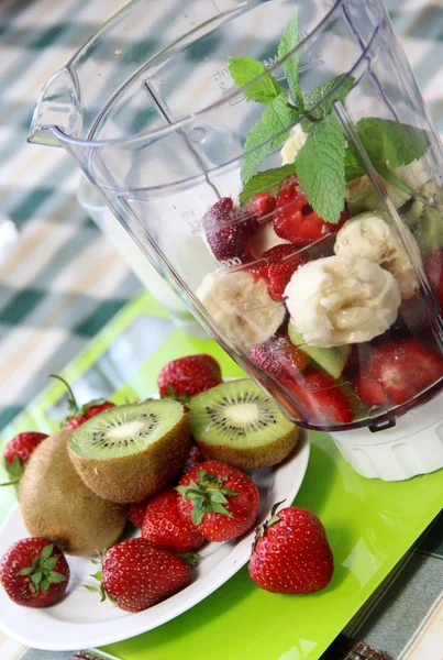 Fresh fruits in the blender — Stock Photo, Image