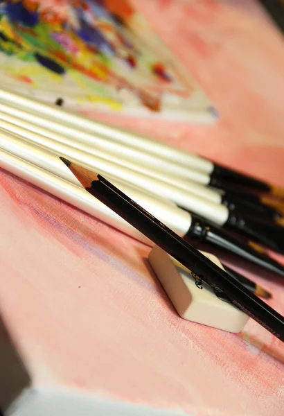 Art palette and mix of paintbrushes — Stock Photo, Image