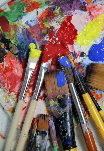 Art palette and mix of paintbrushes — Stock Photo, Image