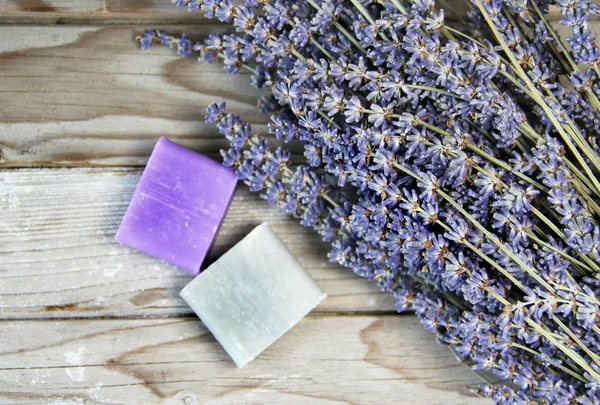 Mix of lavender flowers and cosmetic — Stock Photo, Image