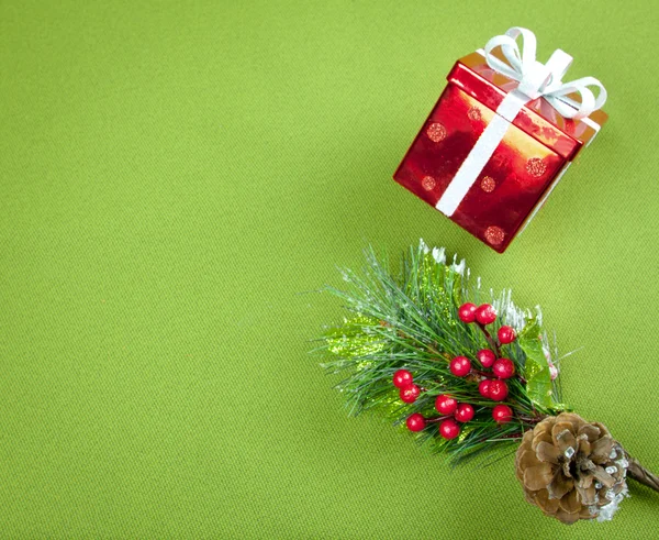 Red Box And Christmas Leaves Background — Stock Photo, Image