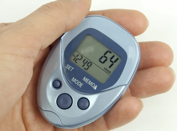 Pedometer In Hand — Stock Photo, Image