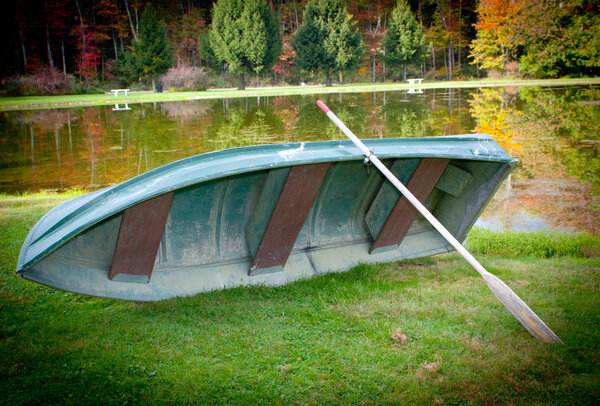 Boat By The Lake In The Fall Season