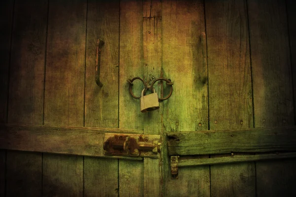 Locked wooden door with padlock — Stock Photo, Image