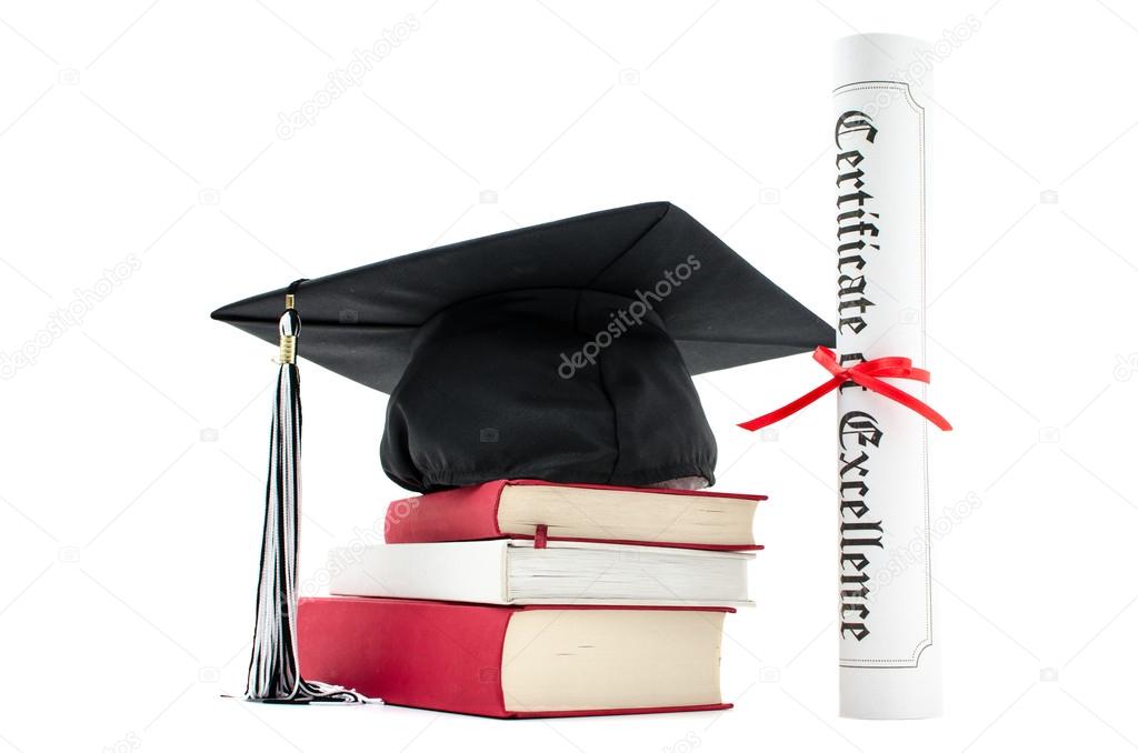 Grad hat and diploma with book isolated on white