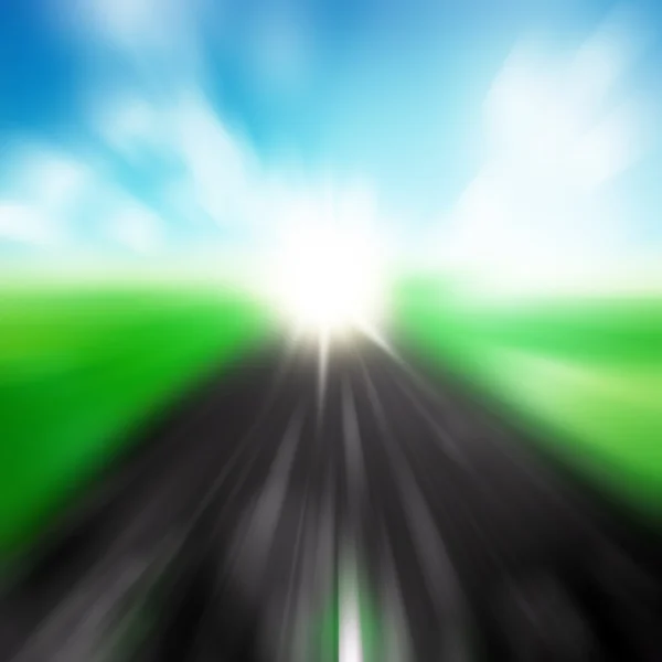 Blurred asphalt road and blue motion blurred sky with clouds and — Stock Photo, Image