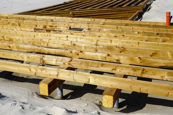 Construction of a new wooden board terrace on the sandy beach to improve the beach infrastructure