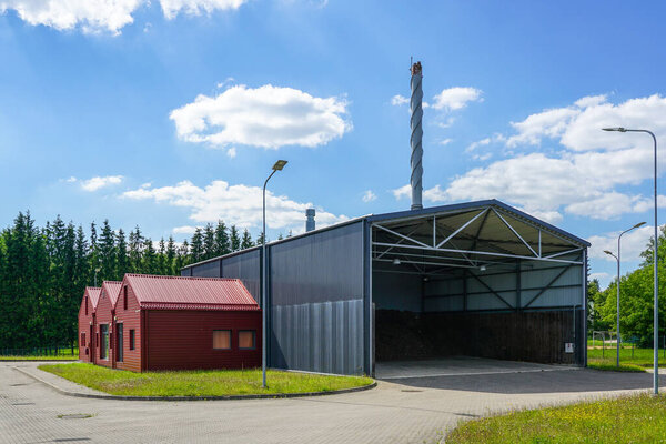 A small new modern wood chip heating thermal power plant in a rural area