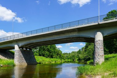 Beautiful stone and reinforced concrete bridge over the Abava River in Renda, Latvia, Europe, built in 1936, renovated in 2018