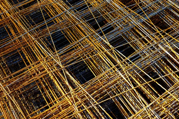 Patterns of rusty welded reinforcement construction steel mesh