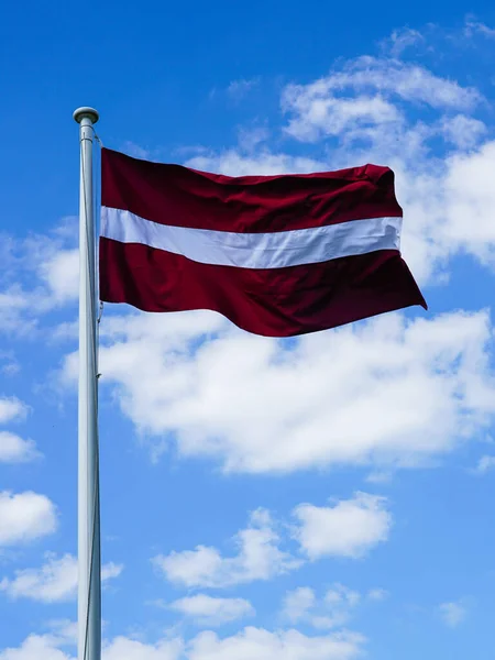 Latvian State Flag Mast Waving Wind Blue Sky White Clouds — Stock Photo, Image