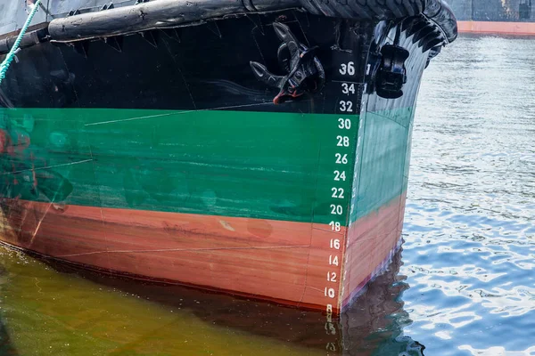 ship's draft scale, close-up of waterline markings scale on the moored ship's bow