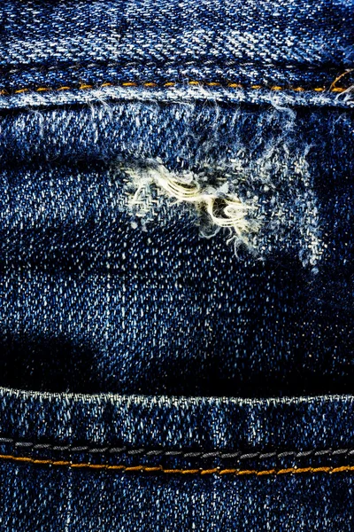 Worn blue denim jeans texture — Stock Photo, Image