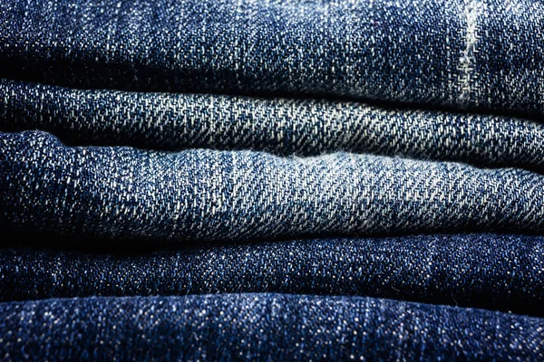 Stack of blue jeans closeup — Stock Photo, Image