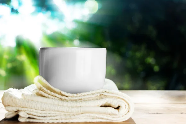 Instant coffee in white cup on wood table against landscape — Stock Photo, Image