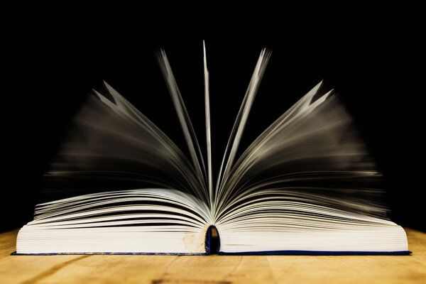 open book on wood table