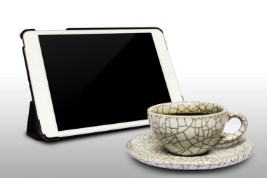 Digital white tablet and coffee cup isolated on white background clipart