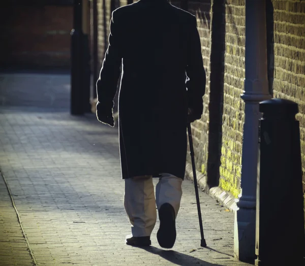 Man with stick — Stock Photo, Image