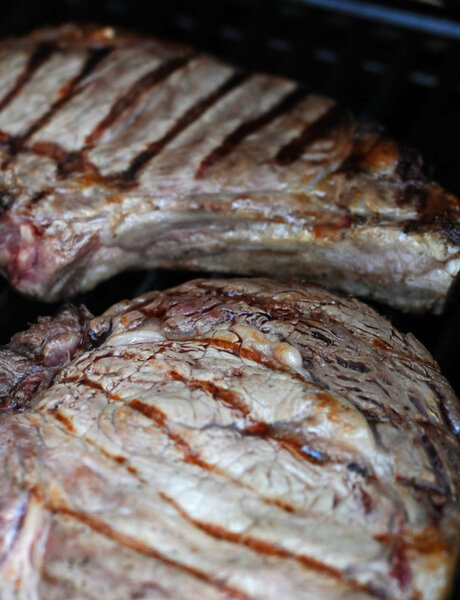 Close up of steaks on grill for dinner