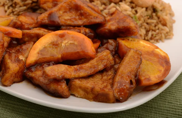 Close up of tofu with orange sauce — Stock Photo, Image