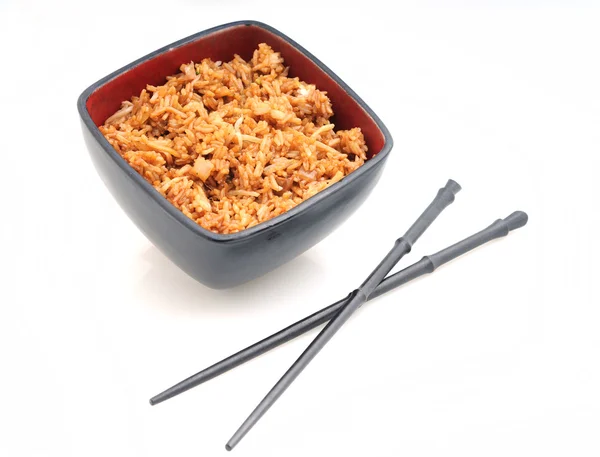 Fried rice in red bowl with chopsticks — Stock Photo, Image